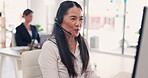 Asian woman, call center and consulting on computer in customer service, telemarketing or support at office. Female consultant agent talking with headphones to client for online advice or help on PC