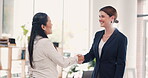 Business people, handshake and meeting for interview, partnership and b2b or deal together at office. Happy women employees shaking hands for introduction, greeting or teamwork agreement at workplace