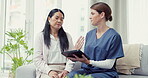 Healthcare, patient and doctor with tablet, consultation and discussion for diagnosis, cure and trust. Asian woman, female and medical professional with device, telehealth and search website for info