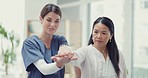 Physiotherapist, doctor and Asian woman stretching arm, healthcare and consultation for bruise, care and movement. Physical therapy, female patient and medical professional with support and healing