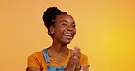 Face, applause or happy black woman celebrate achievement, success goals or winning congratulations. Happiness, winner or studio person celebration for news, victory and clapping on orange background