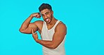 Gym, fitness and man flexing in mockup space or green screen, information on muscle building tips in studio. Health, pointing and exercise motivation by Indian personal trainer or sports instructor.