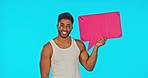 Speech bubble, mockup and face of a man in a studio for advertisement, marketing or product placement. Happy, smile and portrait of a male model with a cardboard sign with mock up by blue background.