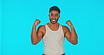 Fitness, celebration and face of man pointing in studio on mockup for advertising, space and blue background. Portrait, gym and mexican personal trainer flexing with healthy lifestyle motivation
