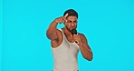 Singer, rapper and man dancing with microphone in studio to sing or rap on blue background. Happy male model, artist or musician dance for hip hop music performance for a live concert or event