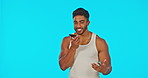 Phone call, hand gesture and a man on a blue background in studio talking with excitement on his mobile. Contact, conversation and communication with a male chatting or speaking using a smartphone