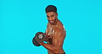 Fitness, weightlifting and flex with indian man in green screen studio for workout, muscle and power. Strong, exercise and training with male on blue background for sports, dumbbell and confidence