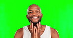 Black man, smile and touching face on green screen with beauty, facial and grooming on studio background. Portrait, hygiene and cosmetic care with mockup space and happy male with dermatology