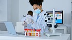 Woman, scientist and laptop with vial sample for testing, examination or scientific research with mask in lab. Female doctor in science with test tube in data capture on computer for medical results