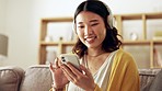 Phone, meme or girl in headphones on social media reading funny online content for gossip blog website. Mobile app, relaxing music or happy Asian woman searching comedy videos or posts on internet
