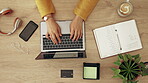 Above, workspace and hands typing on a laptop, planning work and responding to emails. Desk, online and a business person with a computer for a proposal, inspiration and research for a project