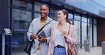 Business people, laughing and walking in city friends outdoor on coffee break in street. Funny, interracial and black man and woman in discussion, speaking or talking together, travel or bonding.