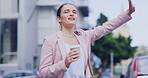 City, travel and a woman hailing a taxi while commuting outdoor for transport on a street in the day. Commute, traffic and a female waving at a cab while drinking coffee on the road of an urban town