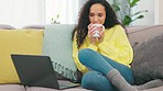 Laptop, coffee or woman streaming a movie on sofa living room via internet for relaxing entertainment. Drinking tea, videos or happy girl watching online series or films on pc at home on subscription