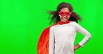 Happy, mockup and a superhero girl on a green screen isolated on a studio background. Smile, power and face portrait of a child in a costume, playing and dressing up for halloween with space