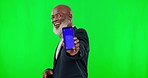 Green screen, phone and black man isolated on studio background for business mockup space or mobile app marketing. Face of professional senior person, cellphone tracking marker and product placement