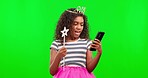 Princess, happy and child in a studio with green screen in celebration of good news on a phone. Happiness, technology and girl kid with a fairy cosplay outfit and cellphone by chroma key background.
