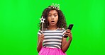 Shock, phone and child in a studio with green screen reading news or an online text message. Surprise, technology and girl kid with a wtf, omg or wow expression on cellphone by chroma key background.
