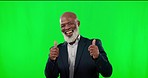 Thumbs up, face and man in a studio with green screen with success, winning or achievement. Happy, smile and portrait of African senior male model with approval hand gesture by chroma key background.