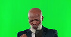 Phone, winner and an elderly business black man on a green screen background in studio for celebration. Wow, contact and promotion with a senior male cheering a good news announcement on his mobile