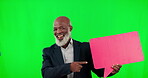 Green screen, speech bubble and man point mockup space for social media, chat icon and networking cardboard sign. Professional, senior and african person with voice communication or opinion in studio