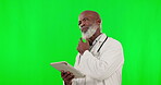 Tablet, green screen and doctor thinking isolated on studio background telehealth, medical or service software idea. Healthcare professional or senior black man contemplating solution on digital tech