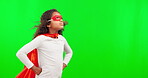 Mockup, superhero and children with a girl on a green screen background in studio standing hands on hips. Kids, justice and costume with a female child hero playing fantasy as a crime fighter