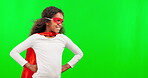 Mock up, superhero and children with a girl on a green screen background in studio standing hands on hips. Kids, justice and costume with a female child hero playing fantasy as a crime fighter