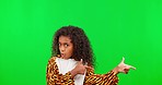 Playful, green screen and face of a girl pointing in a costume isolated on a studio background. Comic, funny and portrait of a child showing mockup space with finger guns on a backdrop for halloween