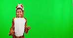 Costume, dance and child in a studio with green screen in a tiger outfit doing a scratching movement. Happy, smile and portrait of girl kid model in an animal cosplay outfit by chroma key background.