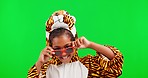 Tiger, dress up and child face with green screen in a studio feeling playful with sunglasses. Comic, excited and crazy kid portrait with funny, comedy and joke from little girl with happiness