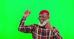 Funky, face and black man pointing on a green screen isolated on a studio background. Stylish, happy and a portrait of a senior African guy with retro fashion, trendy style and showing mockup