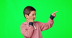 Shock, face and boy pointing on a green screen isolated on a studio background. Wow, happy and a child with a gesture to mockup space, surprise and expression of amazement on a chromakey backdrop