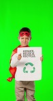 Child hero, pointing and green screen in studio with poster for recycling, accountability or face in mockup. Superhero, boy or protest with hey you, anger or future of earth for ecology by background