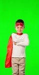 Child, superhero costume and green screen studio with arms crossed, face and mock up with mask. Boy, kid and hero with cape for fantasy, portrait and games in childhood development by background