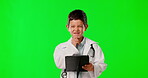 Face, doctor and kid with tablet on green screen isolated on background in studio on a mockup. Confused, portrait and thinking boy with touchscreen technology for healthcare, medical and pretend.