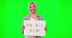 Islamic woman, poster and face by green screen, studio or happiness for charity, public or community care. Muslim, young female or paper sign for donation with smile, portrait or mockup by background