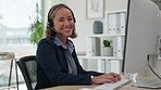 Asian woman, call center and face with headphones typing on computer for customer service or support. Portrait of happy female consultant agent smile on PC with headset for online advice at workplace