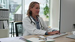 Medical, office and portrait of woman doctor typing on a computer and working on a project or medicine report. Healthcare, research and female professional writing an email online or using internet