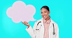 Speech bubble, doctor and woman with poster smile in studio for announcement, information and news. Social media space, healthcare mockup and portrait of medical worker with board on blue background