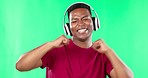 Face, dance and black man with headphones on green screen studio, music and online audio. Dancing, freedom and portrait of guy with podcast, radio or wellness playlist while having fun isolated