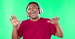 Headphones, dance and black man on green screen studio, music and singing online audio. Dancing, freedom and happy guy with podcast, radio or wellness playlist while having fun on mockup background