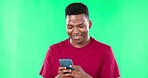 Texting, phone and black man on green screen studio happy, chatting and browsing against mockup background. Social media, streaming and guy search, internet and online for web, meme or reading post