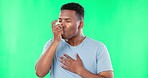 Black man, asthma with inhaler and green screen, health and lungs with breathing problem and mockup. Young male holding chest with medicine, healthcare and medication, treatment on studio background