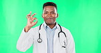 Face, doctor and black man with ok sign on green screen in studio isolated on a background. Portrait, healthcare professional and happiness with hand gesture, success emoji or okay, like or perfect.