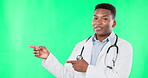 Doctor, smile and black man pointing to green screen in studio isolated on a background mockup. Face portrait, healthcare professional and happiness for advertising, marketing or product placement.