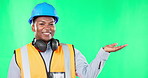 Smile, construction and black man with space on a green screen isolated on a studio background. Happy, engineering and face portrait of African worker showing mock up on a backdrop for advertisement