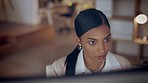 Indian woman, concentration and working night at office, lawyer planning and prepare for case with research at computer. Deadline, overtime and work late at law firm, serious female and focus