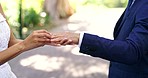 Wedding, ring and hands of man and woman in park for ceremony, commitment and celebration in nature. Relationship, couple and bride and groom outdoors with jewelry for romance, trust and love symbol