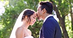 Happy wedding, couple and kiss in park, nature or support of celebration, bridal union or marriage. Bride, groom and kissing forehead in garden for love, life partner or celebrate commitment together